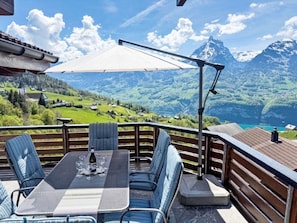 Outdoor Furniture, Furniture, Umbrella, Shade, Chair, Mountain Range, Porch, Outdoor Table, Leisure, Balcony