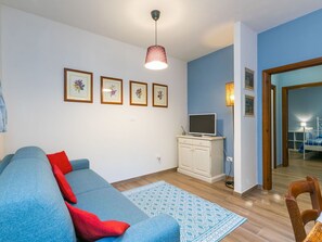 Furniture, Picture Frame, Property, Blue, Comfort, Wood, Interior Design, Living Room, Couch, Flooring