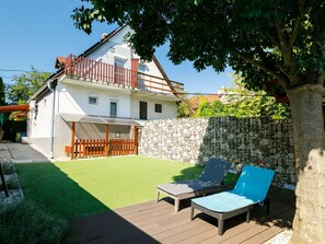 Sky, Building, Property, Table, Furniture, Cloud, Mountain, Interior Design, Outdoor Furniture, Wood