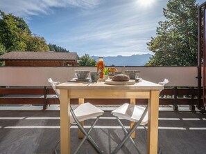 Cloud, Table, Furniture, Sky, Property, Food, Tableware, Outdoor Table, Plant, Wood