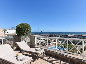 Water, Sky, Cloud, Property, Swimming Pool, Seaside Resort, Azure, Blue, Building, Outdoor Furniture