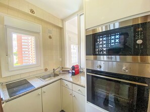 Kitchen, Kitchen Appliance, Major Appliance, Countertop, Cabinetry, Flooring, Kitchen Stove, Wood, Floor, Stove