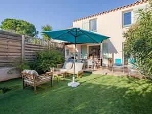 Plant, Sky, Property, Shade, Chair, Land Lot, Building, Window, Outdoor Furniture, Grass