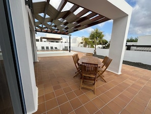 Sky, Property, Furniture, Building, Wood, Porch, Chair, Shade, Interior Design, Outdoor Furniture