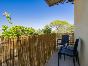 Sky, Property, Furniture, Plant, Azure, Fence, Shade, Wood, Building, Chair