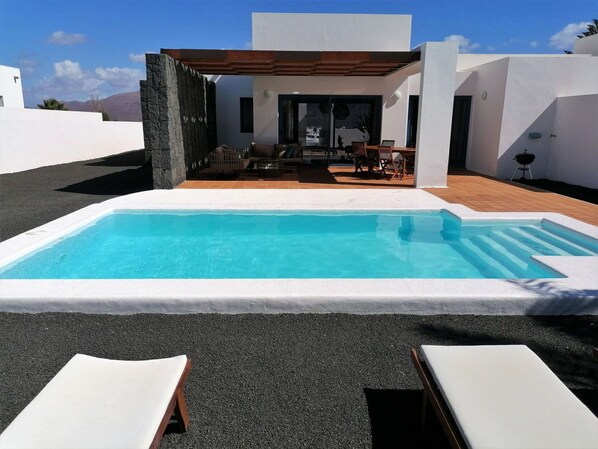 Water, Sky, Property, Furniture, Swimming Pool, Building, Azure, Shade, Rectangle, Outdoor Furniture