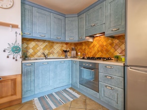 Cabinetry, Countertop, Property, Building, Blue, Wood, Kitchen, Drawer, Interior Design, Kitchen Stove