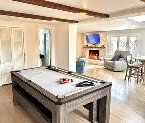 Dinning room table converts into a pool table, and ping pong table.