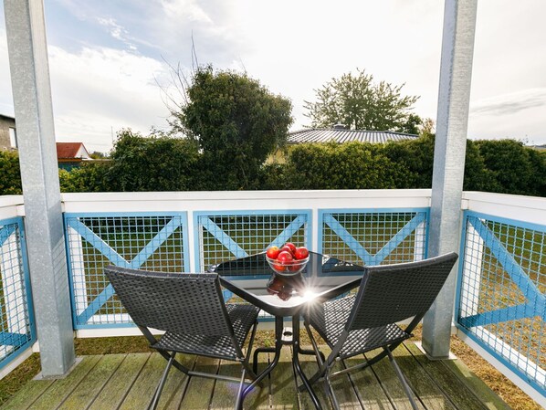 Furniture, Property, Sky, Cloud, Building, Table, Chair, Outdoor Furniture, Shade, Tree