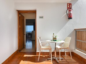 Sky, Property, Furniture, Table, Building, Water, Chair, Wood, Shade, Interior Design