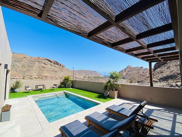 Sky, Property, Furniture, Table, Building, Water, Chair, Wood, Shade, Interior Design