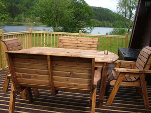 Plant, Furniture, Wood, Tree, Outdoor Table, Outdoor Furniture, Wood Stain, Chair, Flooring, Hardwood