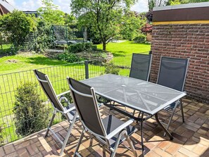 Plant, Furniture, Property, Table, Green, Chair, Outdoor Table, Shade, Outdoor Furniture, Tree