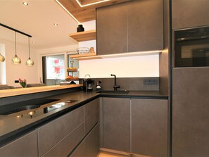 Cabinetry, Countertop, Property, Tap, Sink, Kitchen Stove, Kitchen Appliance, Kitchen, Wood, Building