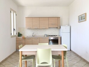 Cabinetry, Furniture, Table, Countertop, Kitchen, Chair, Wood, Interior Design, Flooring, Floor