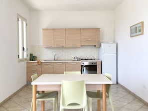 Cabinetry, Furniture, Table, Countertop, Kitchen, Chair, Wood, Interior Design, Flooring, Floor