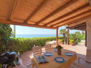 Table, Plant, Furniture, Property, Flowerpot, Shade, Chair, Sky, Outdoor Furniture, Interior Design
