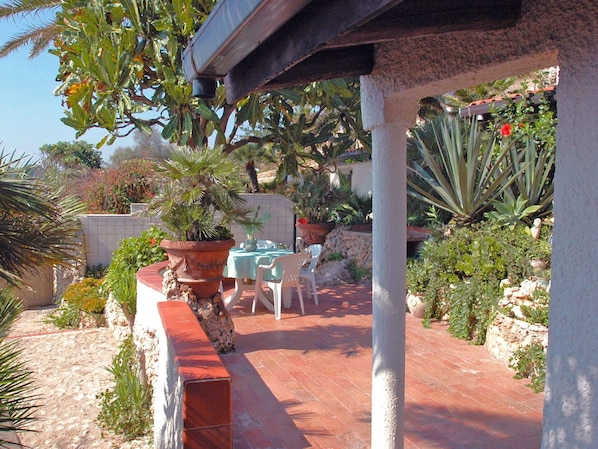Plant, Property, Building, Chair, Shade, Outdoor Furniture, Flowerpot, Outdoor Table, Landscape, Leisure