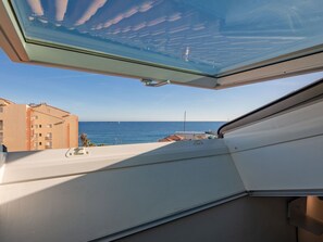 Sky, Furniture, Property, Table, Building, Chair, Shade, Interior Design, Outdoor Furniture, Window