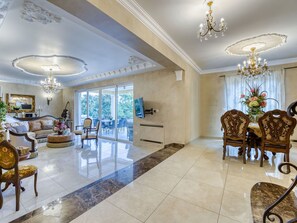 Furniture, Property, Table, Couch, Chair, Lighting, Living Room, Interior Design, Building, Architecture