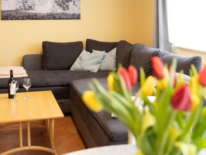 Furniture, Interior Design, Couch, Flooring, Floor, Wood, Yellow, Table, Living Room, Room