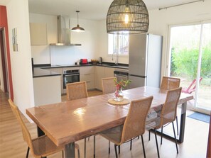 Table, Furniture, Cabinetry, Chair, Countertop, Wood, Lighting, Kitchen & Dining Room Table, Interior Design, Kitchen