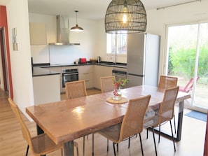 Table, Furniture, Cabinetry, Chair, Countertop, Wood, Lighting, Kitchen & Dining Room Table, Interior Design, Kitchen
