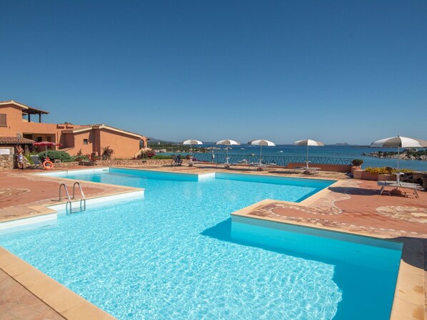 Water, Sky, Property, Swimming Pool, Azure, Building, Outdoor Furniture, Shade, Seaside Resort, Leisure