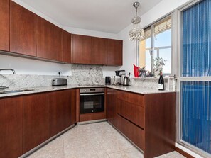 Cabinetry, Countertop, Kitchen Sink, Sink, Blue, Kitchen, Wood, Window, Kitchen Appliance, Building