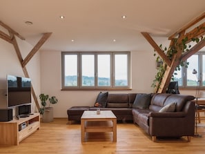 Furniture, Couch, Property, Plant, Comfort, Building, Wood, Houseplant, Living Room, Lighting