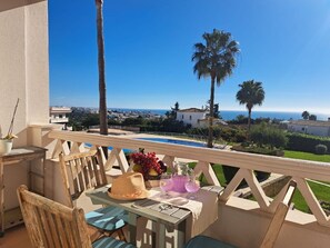 Sky, Property, Building, Table, Plant, Outdoor Furniture, Seaside Resort, Tree, Chair, Shade
