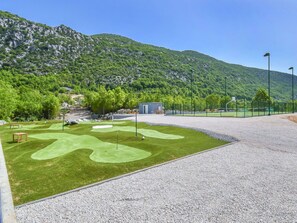 Sky, Street Light, Plant, Mountain, Tree, Land Lot, Asphalt, Natural Landscape, Grass, Urban Design