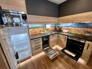 Countertop, Property, Cabinetry, Kitchen Stove, Kitchen, Wood, Interior Design, Kitchen Appliance, Flooring, Floor