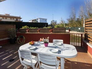 Sky, Table, Furniture, Property, Chair, Tableware, Flowerpot, Building, Outdoor Table, Outdoor Furniture