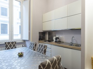 Property, Cabinetry, Window, Countertop, Kitchen Stove, Interior Design, Wood, Flooring, Floor