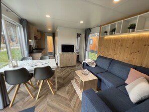 Furniture, Table, Couch, Picture Frame, Living Room, Lamp, Floor, Flooring, Wood, Comfort