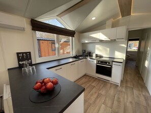 Cabinetry, Property, Countertop, Furniture, Kitchen Stove, Kitchen Appliance, Kitchen, Sink, Wood, Architecture