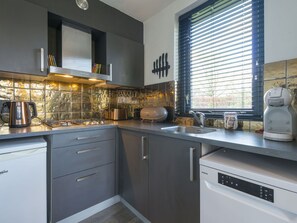 Cabinetry, Countertop, Property, Kitchen Sink, Window, Kitchen, Kitchen Appliance, Building, Lighting, Wood