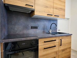 Cabinetry, Countertop, Property, Kitchen Sink, Sink, Tap, Black, Kitchen Stove, Kitchen, Wood