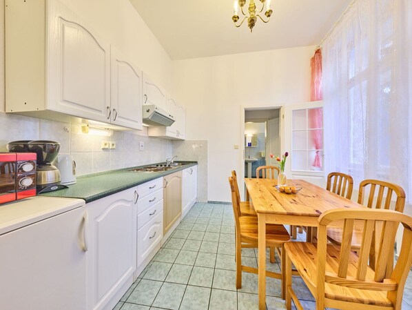 Cabinetry, Property, Furniture, Countertop, Chair, Kitchen Appliance, Kitchen Stove, Wood, Sink, Lighting
