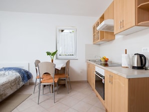 Cabinetry, Furniture, Countertop, Property, Building, Table, Kitchen Appliance, Kitchen, Wood, Kitchen Stove