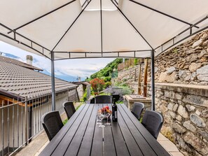Furniture, Shade, Table, Chair, Plant, Wood, Outdoor Furniture, Leisure, Tree, Roof