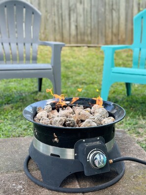 Propane fire pit - easy to use, all the ambience of a fire pit without the mess! Great for s'mores and more.