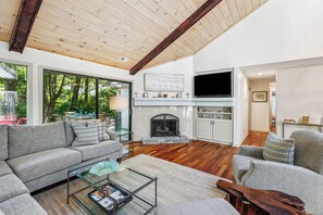 Comfortable sectional with smart TV and an abundance of natural light