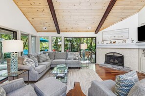 Comfortable sectional with smart TV and an abundance of natural light