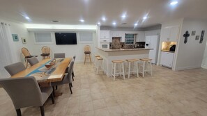 dinning room and  kitchen with local channels on 📺 TV
