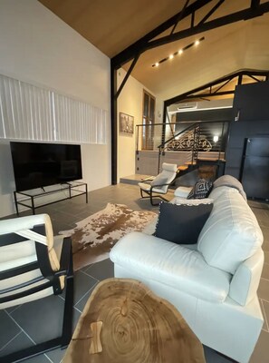 Spacious Living Room with Comfortable Couch and TV