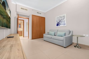 Living Room: Relax with style in a light-filled space featuring modern décor and cozy seating!