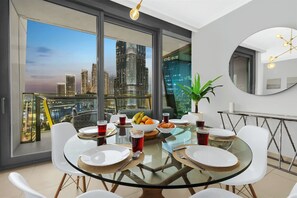 Dining Room: Savor meals with stunning skyline views and modern decor in a vibrant setting!