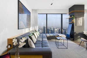 Living Room: Stunning skyline views from a chic space perfect for relaxation or entertaining!